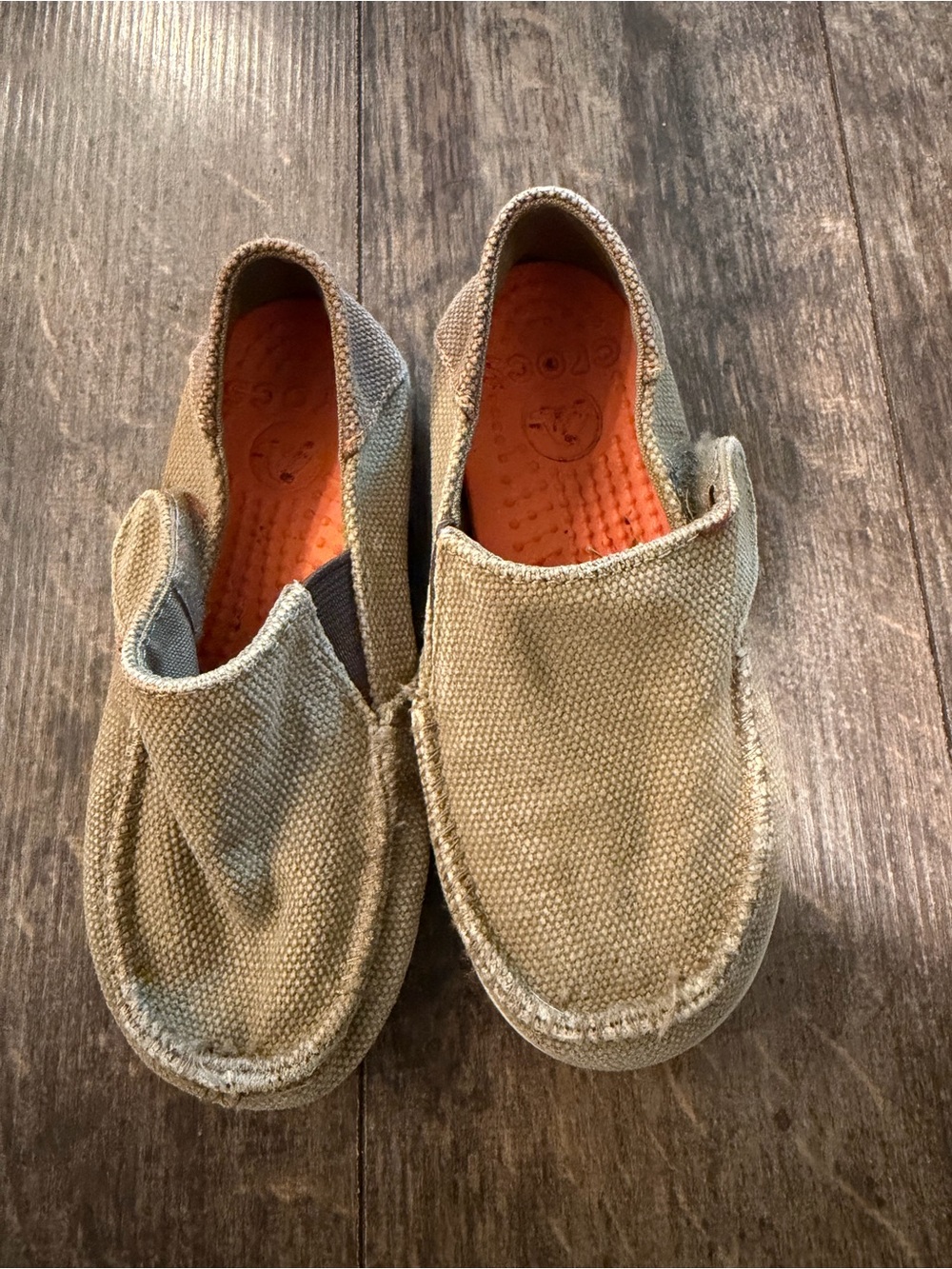 CROCS Kids Canvas Slip-Ons in Olive Green with Orange Insole